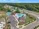 Aerial view of a community pool, playground, and amenity center at 325 Buckhorn Branch Park, Clayton, NC 27520