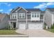 Charming two-story home featuring a two-car garage and beautifully landscaped front yard at 325 Buckhorn Branch Park, Clayton, NC 27520