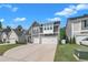 Inviting two-story house showcasing a two-car garage and tidy front yard in a serene neighborhood at 325 Buckhorn Branch Park, Clayton, NC 27520
