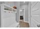 Functional mudroom with hooks and a view into the adjacent bathroom area at 325 Buckhorn Branch Park, Clayton, NC 27520