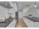 Modern kitchen featuring white cabinets, stainless steel appliances, and an open layout at 325 Buckhorn Branch Park, Clayton, NC 27520