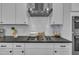 Close up on kitchen with stainless hood over gas range at 325 Buckhorn Branch Park, Clayton, NC 27520