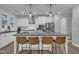 Modern kitchen island featuring a white countertop with seating for four and sleek appliances at 325 Buckhorn Branch Park, Clayton, NC 27520