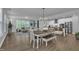 Open-concept living space with dining area, modern kitchen, and comfortable seating arrangement at 325 Buckhorn Branch Park, Clayton, NC 27520