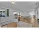 Bright, open-concept living space with modern kitchen, dining area, and comfortable seating at 325 Buckhorn Branch Park, Clayton, NC 27520