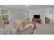 Cozy main bedroom showcases a comfortable bed, a TV, and views from the room's several windows at 325 Buckhorn Branch Park, Clayton, NC 27520