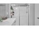 Modern bathroom featuring a glass-enclosed shower with tile surround, and a bright vanity with storage at 325 Buckhorn Branch Park, Clayton, NC 27520