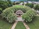 Community park gazebo, surrounded by flowers and lush landscaping at 327 Commons Walk Cir, Cary, NC 27519