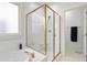Well-lit bathroom with bathtub and shower, showcasing tile work at 327 Commons Walk Cir, Cary, NC 27519