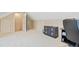 Attic bedroom featuring an extra storage closet with a sloped ceiling and built-in cabinets at 327 Commons Walk Cir, Cary, NC 27519