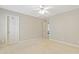 Open bedroom with white ceilings, neutral walls, and doors with gold handles at 327 Commons Walk Cir, Cary, NC 27519