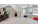 Spacious bedroom with a ceiling fan and multiple windows providing natural light at 327 Commons Walk Cir, Cary, NC 27519
