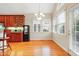 Bright breakfast nook with ample natural light and wood flooring at 327 Commons Walk Cir, Cary, NC 27519