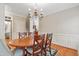 Traditional dining room featuring a chandelier and classic decor at 327 Commons Walk Cir, Cary, NC 27519
