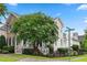 Corner lot showing the side and front of a charming home surrounded by lush landscaping at 327 Commons Walk Cir, Cary, NC 27519