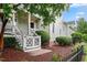 Charming porch with stairs and decorative fence offers a welcoming entrance and curb appeal at 327 Commons Walk Cir, Cary, NC 27519
