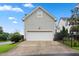 Two car garage and driveway providing ample parking and storage space for residents at 327 Commons Walk Cir, Cary, NC 27519