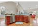 Open kitchen area featuring stainless appliances, bar seating and access to the living space at 327 Commons Walk Cir, Cary, NC 27519