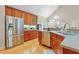 Well-appointed kitchen featuring stainless steel appliances and ample cabinet space at 327 Commons Walk Cir, Cary, NC 27519