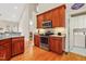 Well-equipped kitchen featuring wood cabinets and stainless-steel appliances at 327 Commons Walk Cir, Cary, NC 27519