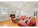 Cozy living room featuring a fireplace, hardwood floors, and comfortable seating at 327 Commons Walk Cir, Cary, NC 27519