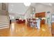 Spacious open-concept living area with kitchen island and stairs to a second level at 327 Commons Walk Cir, Cary, NC 27519