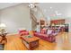 Open-concept layout with hardwood floors and seamless flow between living and kitchen areas at 327 Commons Walk Cir, Cary, NC 27519
