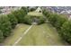 Aerial shot of a community park featuring walking paths and a gazebo surrounded by trees at 327 Commons Walk Cir, Cary, NC 27519