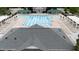 Community pool area featuring lounge chairs, covered seating, and a large swimming pool with marked lanes at 327 Commons Walk Cir, Cary, NC 27519