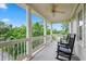Relaxing upper porch with rocking chairs, offering a serene view of the surrounding greenery at 327 Commons Walk Cir, Cary, NC 27519