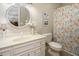 Charming bathroom with a white vanity, floral shower curtain, and round mirror at 3285 Edinburgh Dr, Sanford, NC 27332