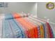 Bedroom featuring two twin beds with bright, colorful patterned quilts at 3285 Edinburgh Dr, Sanford, NC 27332
