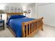 Cozy bedroom featuring a wooden bed frame and blue quilt bedding at 3285 Edinburgh Dr, Sanford, NC 27332