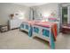 Bright bedroom with two twin beds, colorful bedding, and white dresser at 3285 Edinburgh Dr, Sanford, NC 27332