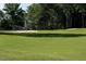 Beautiful golf course view featuring a vibrant green fairway and sand traps at 3285 Edinburgh Dr, Sanford, NC 27332