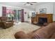 Inviting living room features a fireplace and sliding glass doors to the outside patio at 3285 Edinburgh Dr, Sanford, NC 27332