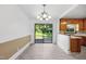 Bright dining area featuring a sliding glass door to the backyard and kitchen access at 330 Wilmot Dr, Raleigh, NC 27606