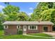 Charming ranch home with a well-maintained lawn and a cozy, inviting entrance at 330 Wilmot Dr, Raleigh, NC 27606