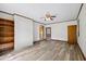 Spacious living room featuring new floors, neutral paint, ceiling fan and a view into the kitchen at 330 Wilmot Dr, Raleigh, NC 27606