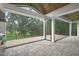 Covered patio with tile flooring and open views of the backyard at 343 Rainforest Pl, Apex, NC 27523