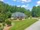 Aerial view of the beautiful home showing the well-maintained lawn and mature trees at 3728 Westbury Lake Dr, Raleigh, NC 27603