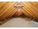 Unfinished attic space showing the exposed wooden beams, insulation and ample headroom at 3728 Westbury Lake Dr, Raleigh, NC 27603
