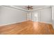 Spacious bedroom with a trey ceiling, ceiling fan, gleaming hardwood floors and ample natural light at 3728 Westbury Lake Dr, Raleigh, NC 27603