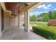 Expansive covered porch with stately columns and views of the landscaped front yard and home at 3728 Westbury Lake Dr, Raleigh, NC 27603