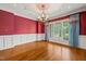 Elegant dining room featuring decorative ceiling, chandelier, and large window at 3728 Westbury Lake Dr, Raleigh, NC 27603