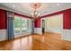 Formal dining room with decorative ceiling, chandelier, and large window at 3728 Westbury Lake Dr, Raleigh, NC 27603