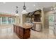 Well-appointed kitchen features a center island, granite countertops, custom cabinets, and a cozy breakfast nook at 3728 Westbury Lake Dr, Raleigh, NC 27603