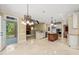 Open kitchen with granite countertops, tile floors, and stainless steel appliances at 3728 Westbury Lake Dr, Raleigh, NC 27603