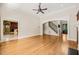 Bright, open living room with hardwood floors and staircase access at 3728 Westbury Lake Dr, Raleigh, NC 27603
