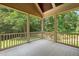Screened porch offering a view of the backyard with mature trees at 3728 Westbury Lake Dr, Raleigh, NC 27603